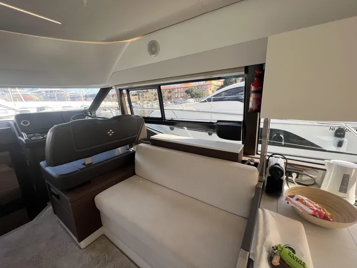  Yacht Photos Pics Interior of 2018 Prestige 460 Fly yacht with modern seating and large windows.