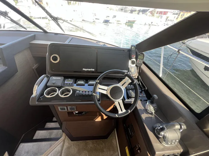  Yacht Photos Pics Helm of 2018 Prestige 460 Fly yacht with Raymarine navigation system.