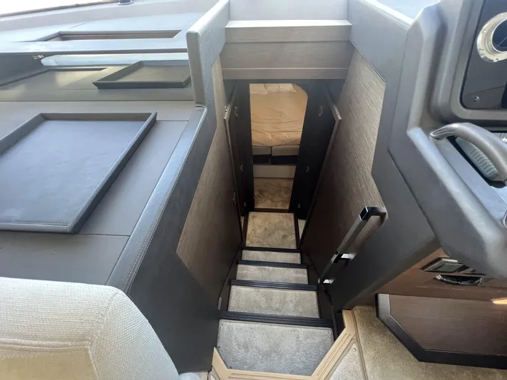  Yacht Photos Pics Interior stairs of 2018 Prestige 460 Fly yacht, leading to lower cabin area.