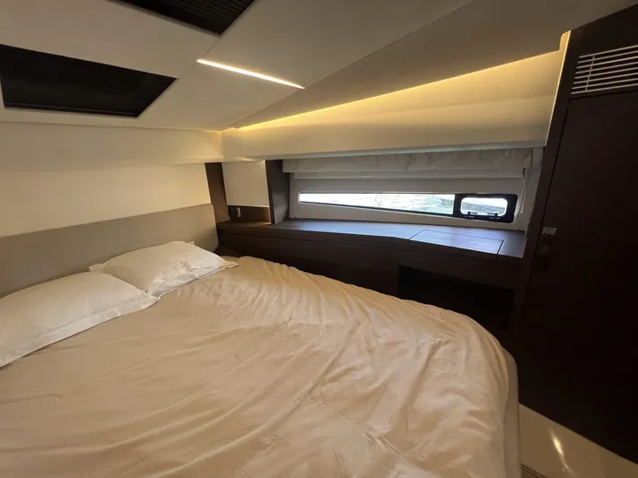  Yacht Photos Pics Luxurious bedroom interior of 2018 Prestige 460 Fly yacht with modern design and ambient lighting.