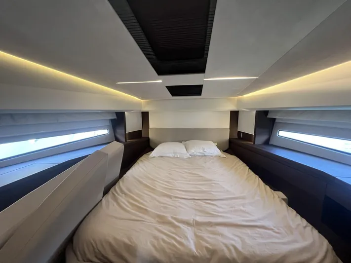  Yacht Photos Pics Luxurious bedroom interior of 2018 Prestige 460 Fly yacht with modern lighting and windows.