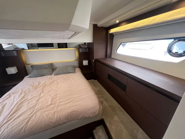 Yacht Photos Pics Luxurious bedroom interior of 2018 Prestige 460 Fly yacht with modern design and natural light.