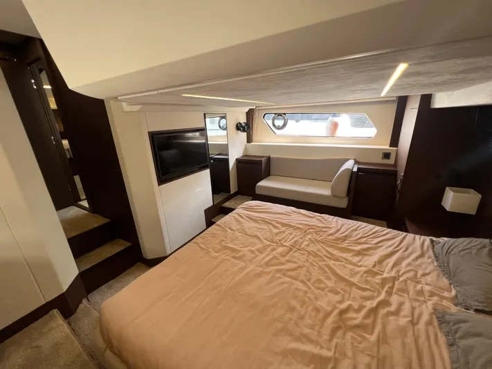  Yacht Photos Pics Luxurious bedroom interior of 2018 Prestige 460 Fly yacht with modern amenities.