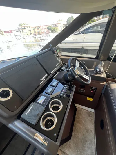  Yacht Photos Pics Helm of 2018 Prestige 460 Fly yacht with modern navigation equipment.