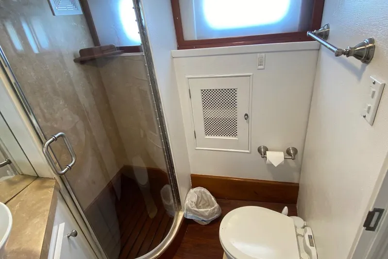 Liberty Love Yacht Photos Pics Bathroom interior of 1954 Trumpy 68 Motor Yacht with shower and toilet.