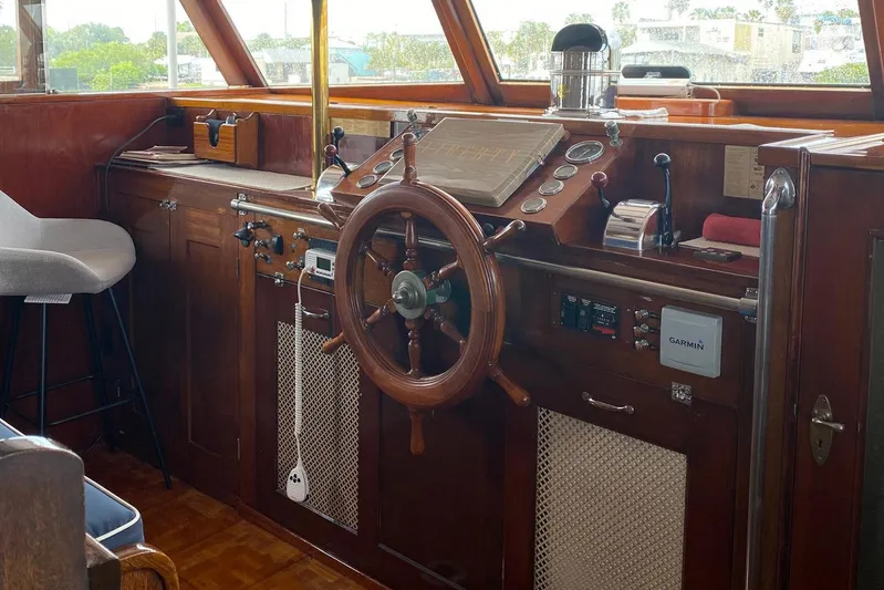 Liberty Love Yacht Photos Pics 1954 Trumpy 68 Motor Yacht helm with wooden steering wheel and navigation instruments.