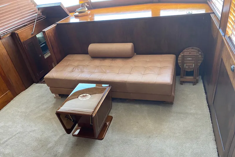 Liberty Love Yacht Photos Pics Luxurious interior of 1954 Trumpy 68 Motor Yacht with leather seating and wooden accents.