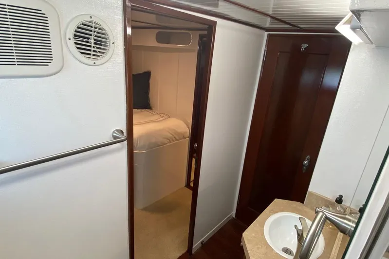 Liberty Love Yacht Photos Pics Interior of 1954 Trumpy 68 Motor Yacht with cozy cabin and wooden finishes.