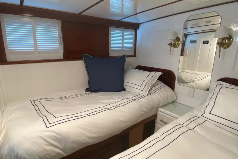 Liberty Love Yacht Photos Pics Luxurious cabin interior of 1954 Trumpy 68 Motor Yacht with twin beds and elegant decor.