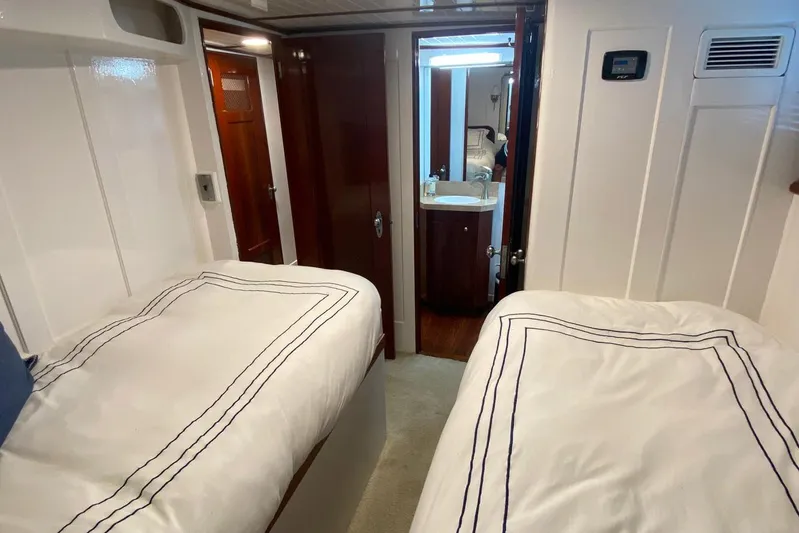 Liberty Love Yacht Photos Pics Interior of 1954 Trumpy 68 Motor Yacht with twin beds and bathroom.