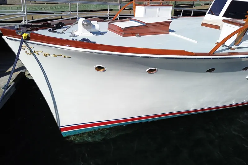 Liberty Love Yacht Photos Pics Classic 1954 Trumpy 68 Motor Yacht with elegant wooden details docked at marina.