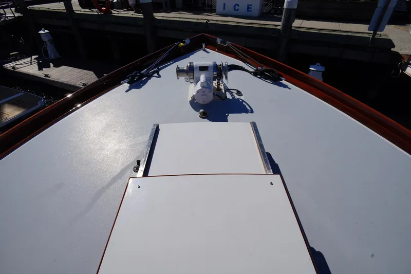 Liberty Love Yacht Photos Pics Bow view of 1954 Trumpy 68 Motor Yacht at dock, featuring deck details.