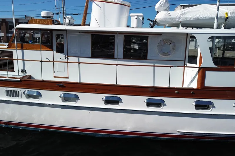 Liberty Love Yacht Photos Pics 1954 Trumpy 68 Motor Yacht with classic wooden detailing and sleek design.