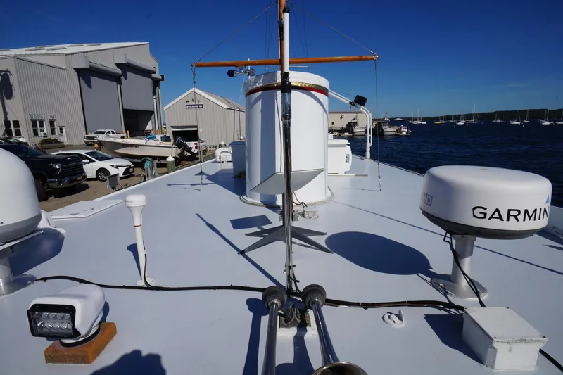 Liberty Love Yacht Photos Pics 1954 Trumpy 68 Motor Yacht deck with navigation equipment and marina view.