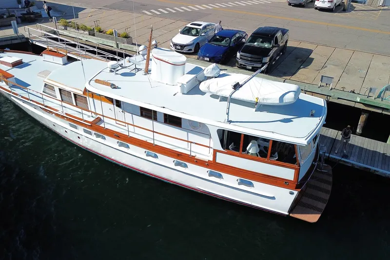Liberty Love Yacht Photos Pics Aerial view of 1954 Trumpy 68 Motor Yacht docked at a marina.