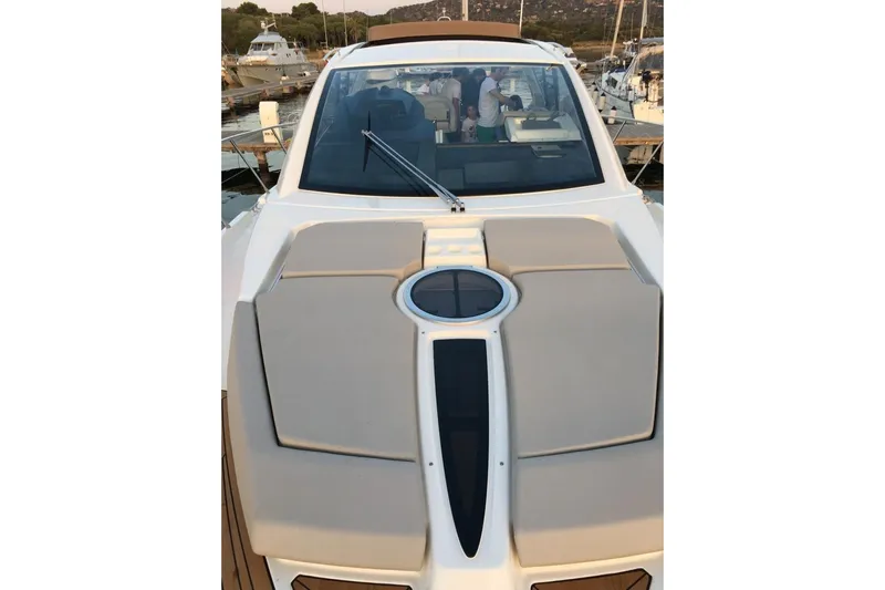  Yacht Photos Pics 2017 Cranchi M 44 HT yacht with sleek design, docked at marina.