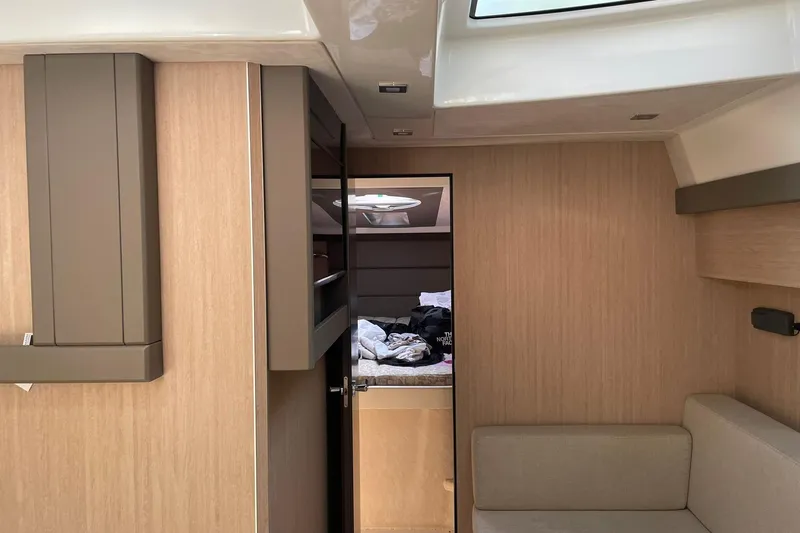  Yacht Photos Pics Interior of 2017 Cranchi M 44 HT yacht with modern wood paneling and cozy seating.