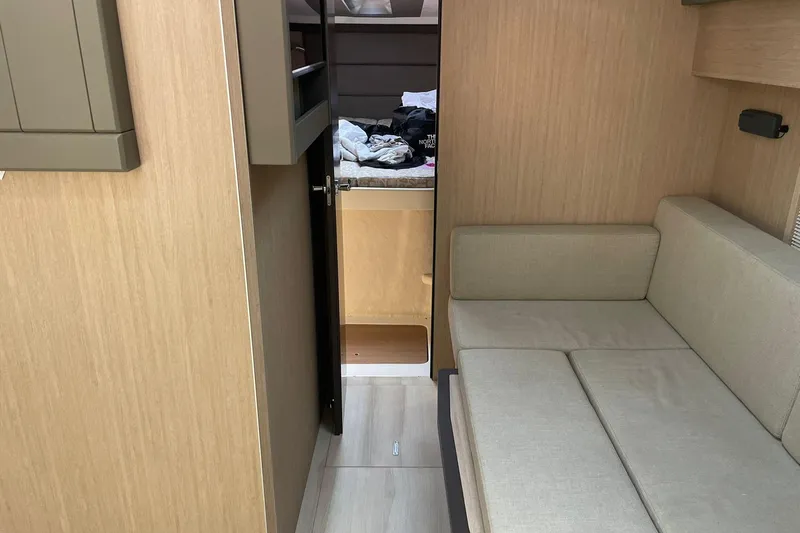  Yacht Photos Pics Interior of 2017 Cranchi M 44 HT yacht with beige sofa and wooden finish.