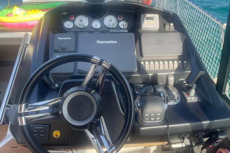  Yacht Photos Pics Helm of 2017 Cranchi M 44 HT yacht with Raymarine and Volvo Penta controls.