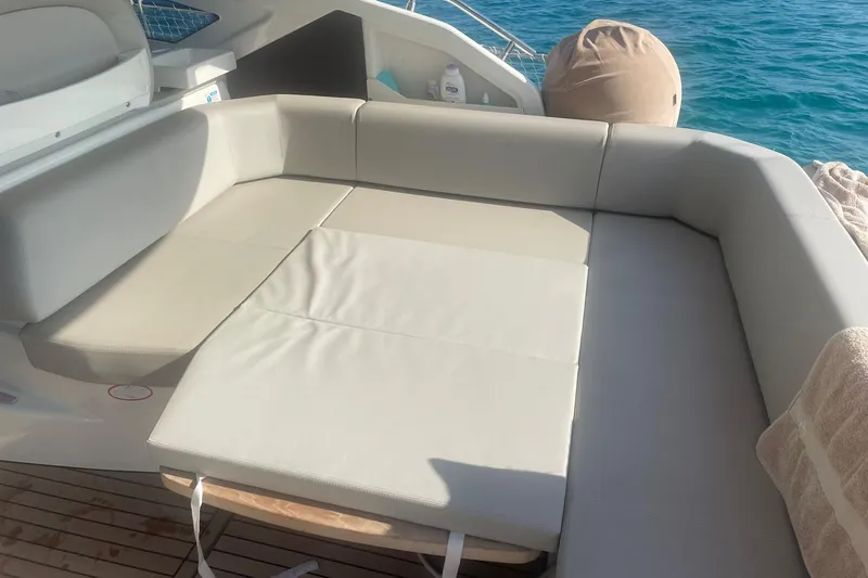  Yacht Photos Pics Luxurious seating area on 2017 Cranchi M 44 HT yacht, overlooking blue ocean waters.