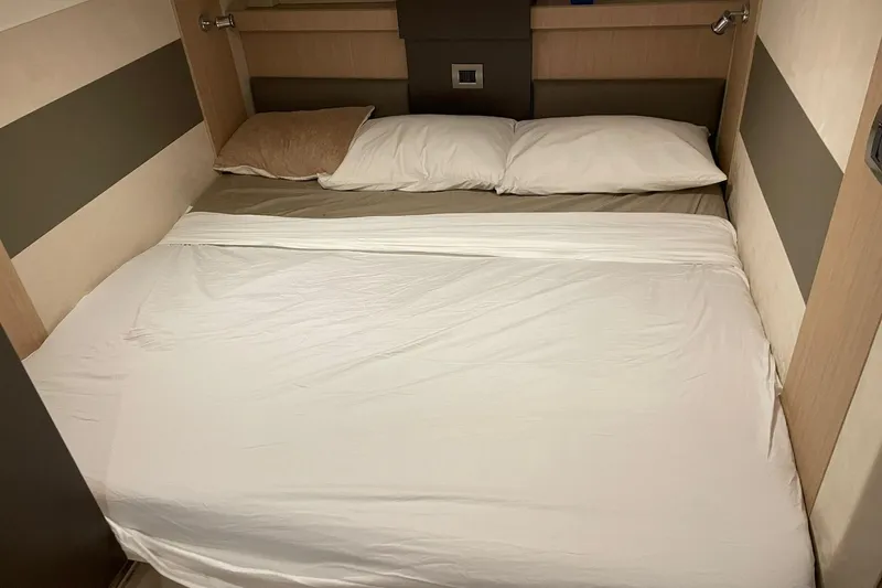  Yacht Photos Pics Cozy bed in 2017 Cranchi M 44 HT yacht cabin with neutral decor.