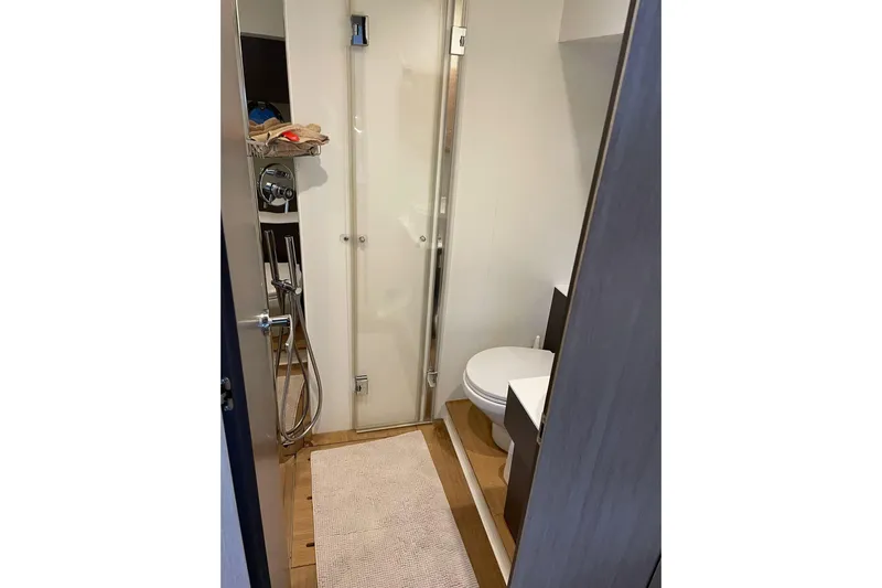  Yacht Photos Pics Bathroom interior of 2017 Cranchi M 44 HT yacht with shower and toilet.