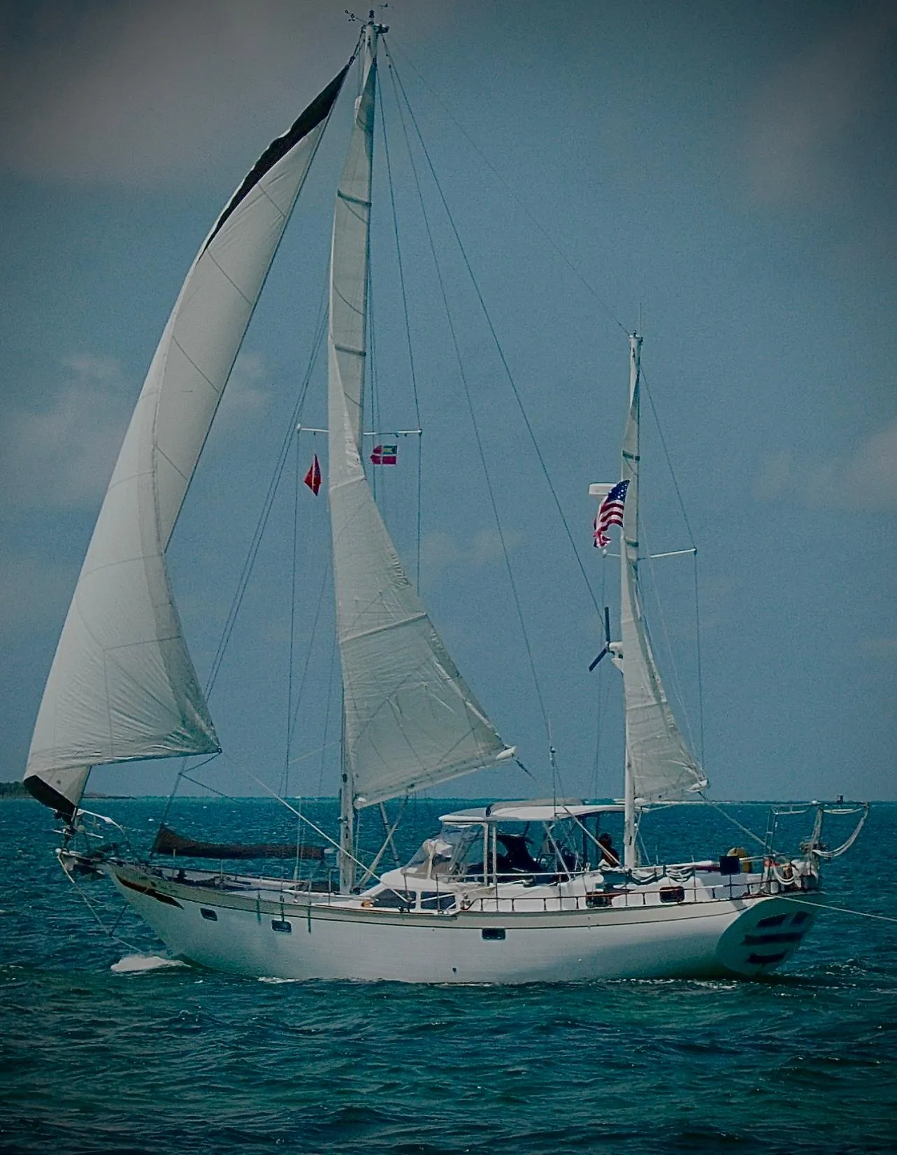 1981 Hardin Voyager 45 Ketch sailing on open sea with full sails.