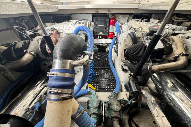 La Vie En Rose Yacht Photos Pics Engine room of 2009 Sea Ray 470 Sundancer with visible hoses and components.
