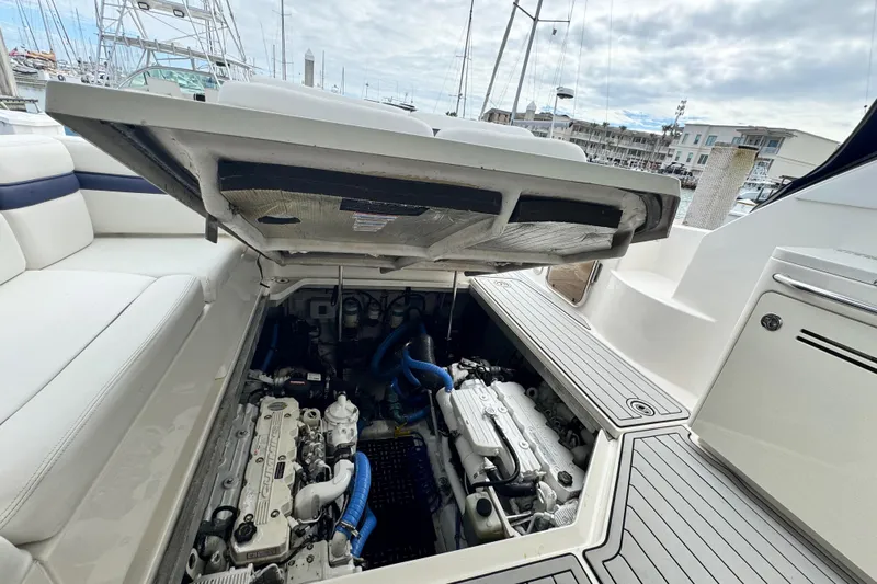 La Vie En Rose Yacht Photos Pics 2009 Sea Ray 470 Sundancer engine compartment with open hatch, docked at marina.