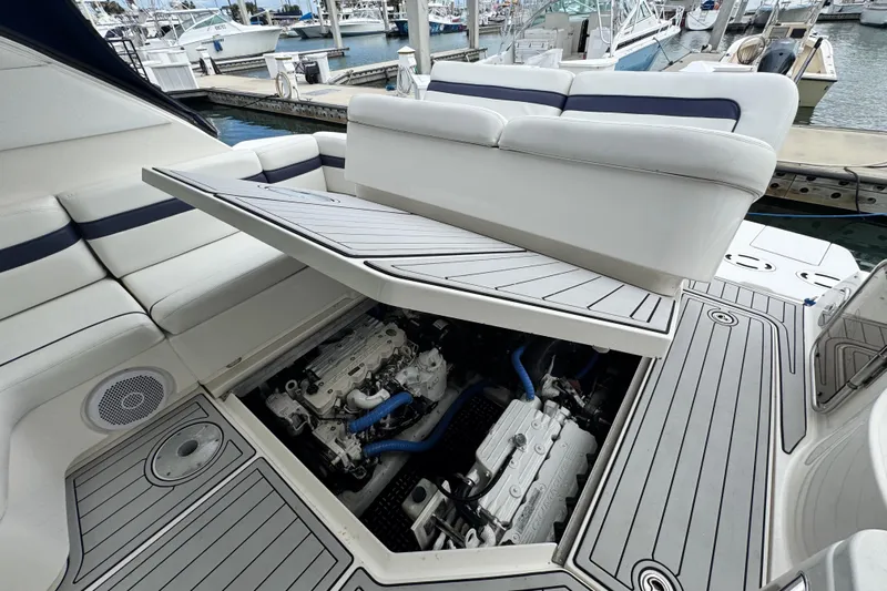 La Vie En Rose Yacht Photos Pics 2009 Sea Ray 470 Sundancer engine compartment with open hatch, docked at marina.
