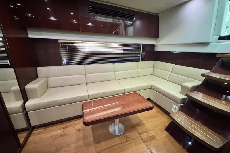 La Vie En Rose Yacht Photos Pics Luxurious interior of 2009 Sea Ray 470 Sundancer yacht with beige leather seating.