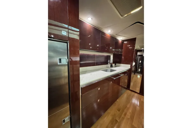 La Vie En Rose Yacht Photos Pics Luxurious kitchen interior of 2009 Sea Ray 470 Sundancer yacht with sleek cabinetry.