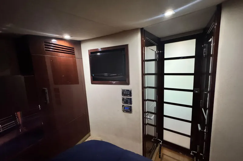 La Vie En Rose Yacht Photos Pics Luxurious interior of 2009 Sea Ray 470 Sundancer with TV and modern glass door.