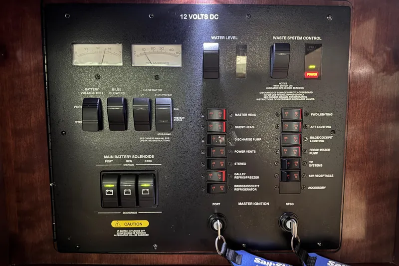 La Vie En Rose Yacht Photos Pics Control panel of a 2009 Sea Ray 470 Sundancer boat, featuring switches and gauges.