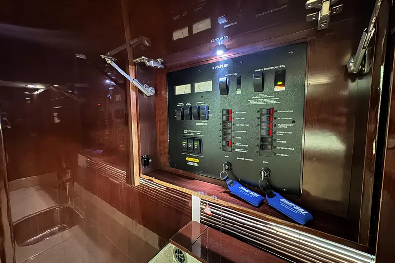 La Vie En Rose Yacht Photos Pics Electrical control panel inside 2009 Sea Ray 470 Sundancer yacht, featuring switches and indicators.