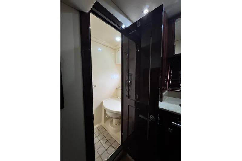 La Vie En Rose Yacht Photos Pics Bathroom interior of 2009 Sea Ray 470 Sundancer yacht, featuring modern fixtures and lighting.