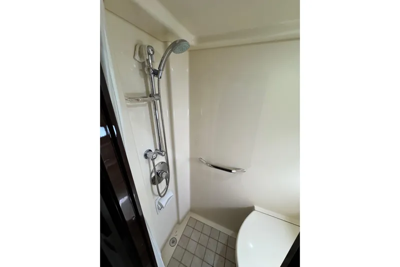 La Vie En Rose Yacht Photos Pics Shower area in 2009 Sea Ray 470 Sundancer yacht, featuring modern fixtures and tiled floor.