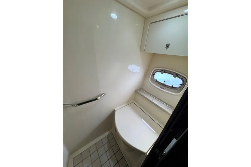 La Vie En Rose Yacht Photos Pics Bathroom interior of 2009 Sea Ray 470 Sundancer yacht, featuring a window and sleek design.