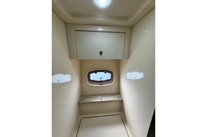 La Vie En Rose Yacht Photos Pics Interior of 2009 Sea Ray 470 Sundancer yacht, featuring a compact cabin space.