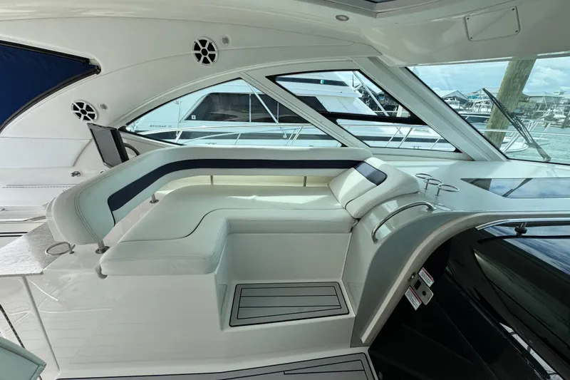 La Vie En Rose Yacht Photos Pics Luxurious interior of 2009 Sea Ray 470 Sundancer yacht with elegant seating and windows.