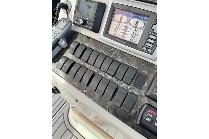 La Vie En Rose Yacht Photos Pics Control panel of a 2009 Sea Ray 470 Sundancer boat with switches and display.