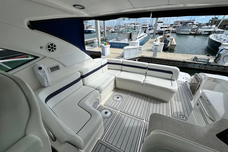 La Vie En Rose Yacht Photos Pics Luxurious 2009 Sea Ray 470 Sundancer yacht interior with white seating at marina.