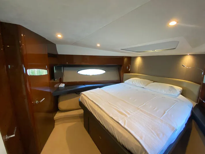  Yacht Photos Pics Luxurious cabin interior of a 2013 Princess 56 yacht with a comfortable bed.