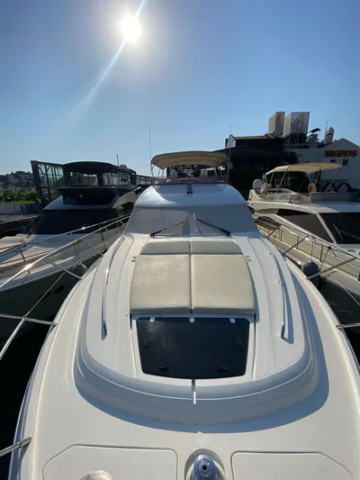  Yacht Photos Pics Luxury 2013 Princess 56 yacht docked under bright sun.