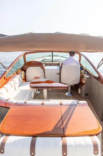 Fiveadrift Yacht Photos Pics 2003 Hinckley Talaria 29R boat interior with elegant wood finish and seating.