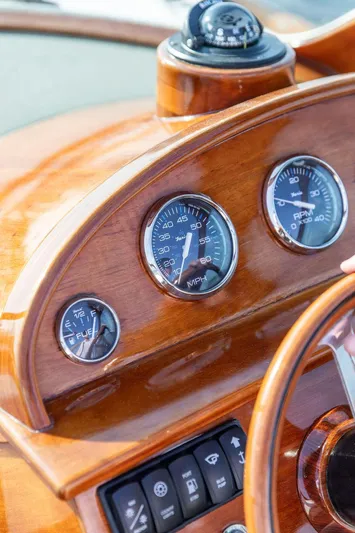 Fiveadrift Yacht Photos Pics Wooden dashboard of 2003 Hinckley Talaria 29R boat with gauges and compass.