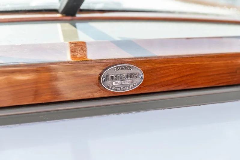 Fiveadrift Yacht Photos Pics 2003 Hinckley Talaria 29R nameplate on polished wood surface.