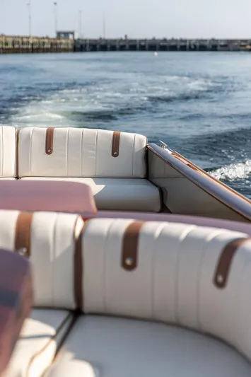 Fiveadrift Yacht Photos Pics 2003 Hinckley Talaria 29R boat interior with white leather seating on open water.