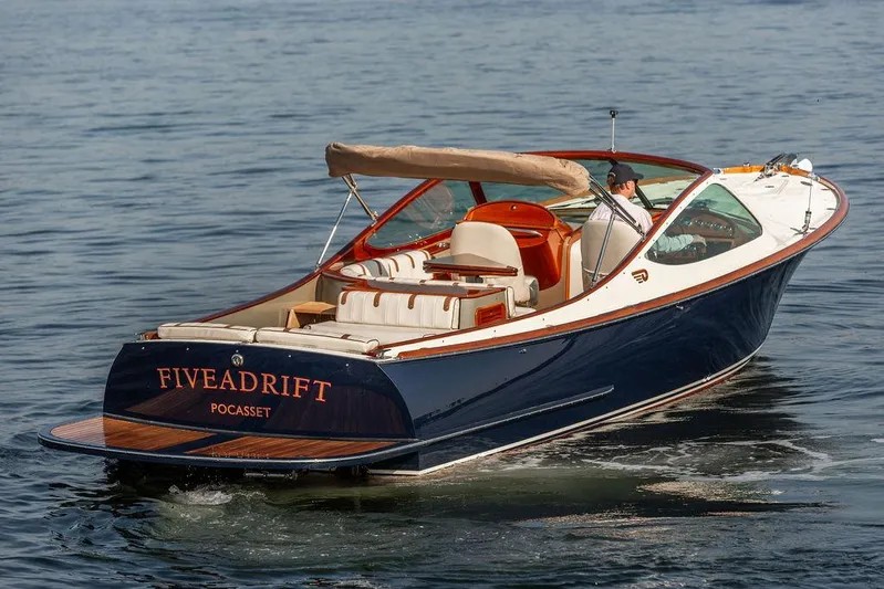 Fiveadrift Yacht Photos Pics 2003 Hinckley Talaria 29R boat cruising on water, featuring elegant design and luxury seating.