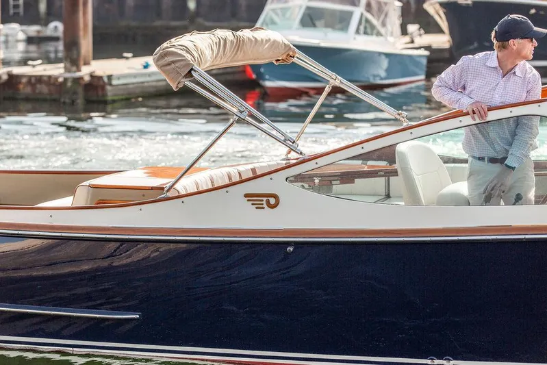 Fiveadrift Yacht Photos Pics 2003 Hinckley Talaria 29R boat with a person onboard, docked in a marina.